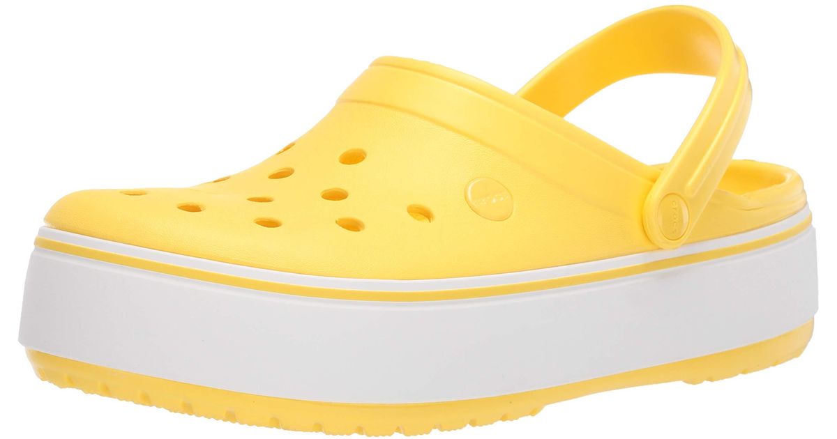 yellow platform crocs
