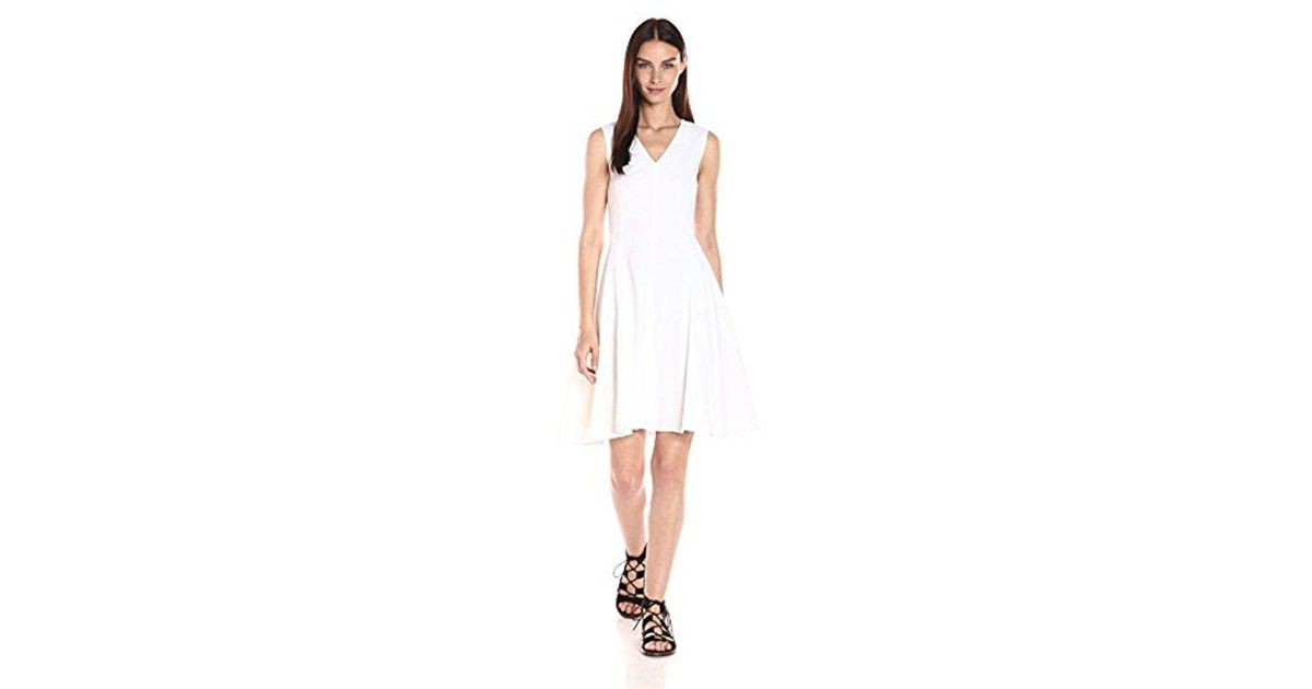 white v neck fit and flare dress