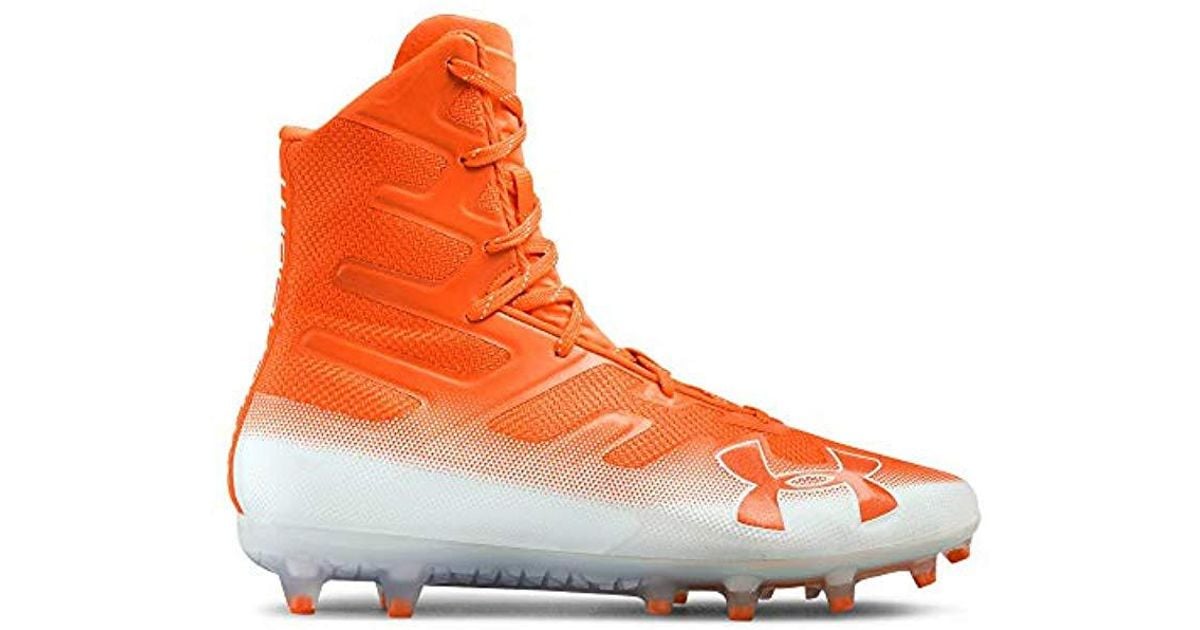 orange and white under armour football cleats