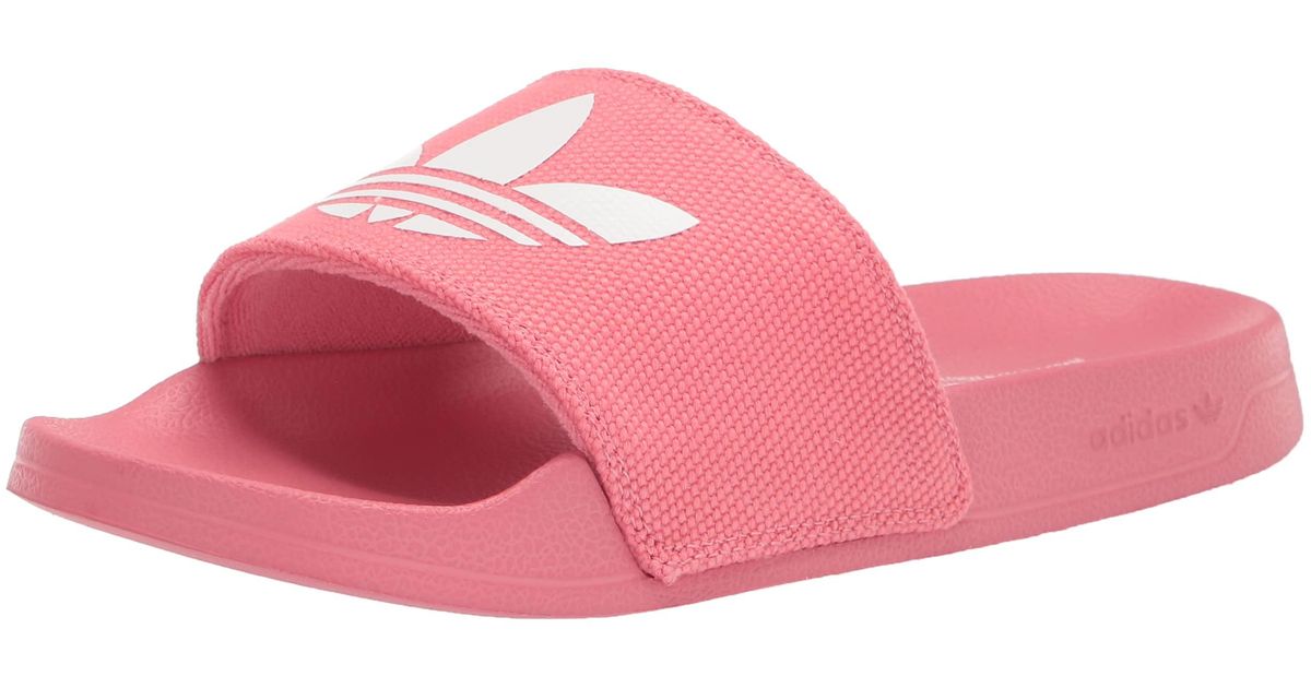 pink and white adidas slides