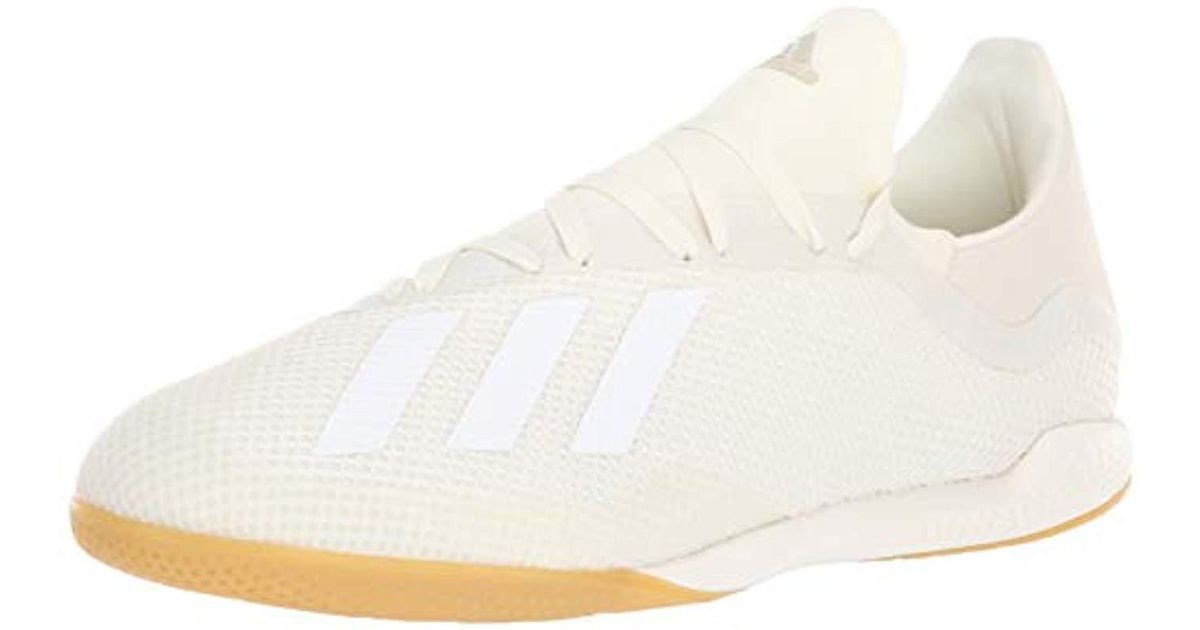 white and gold indoor soccer shoes