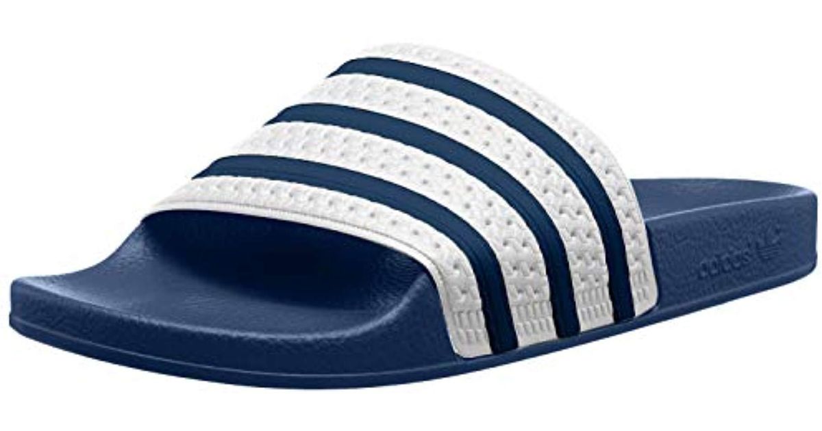 navy blue adidas slides