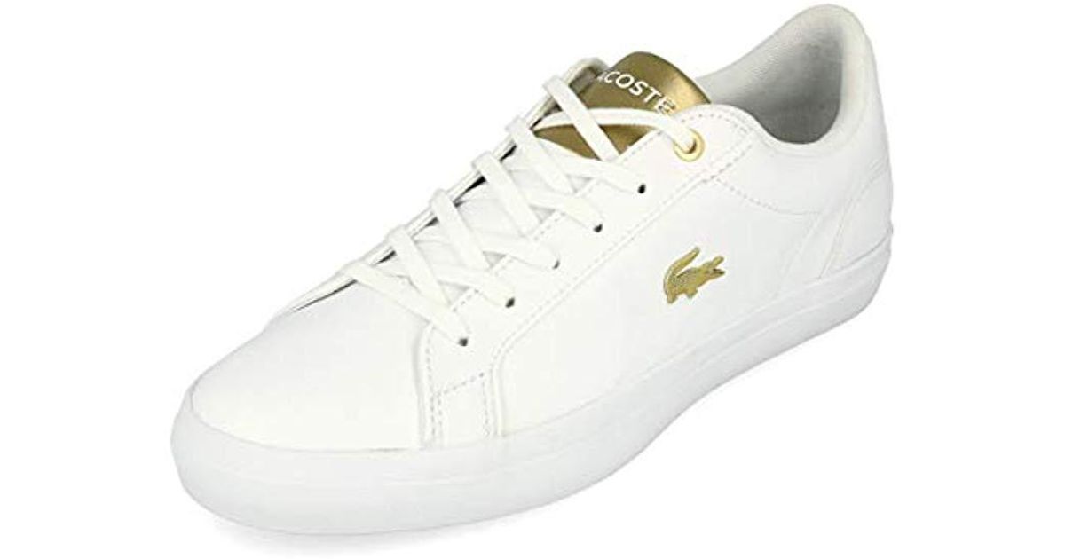 lacoste white and gold trainers