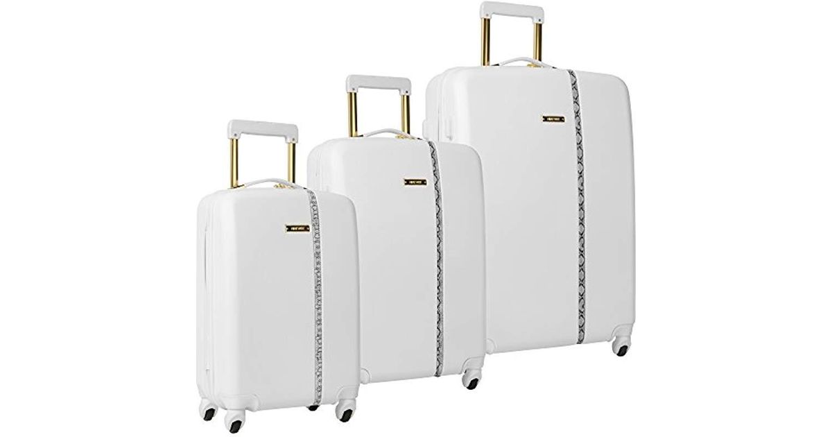 white spinner luggage