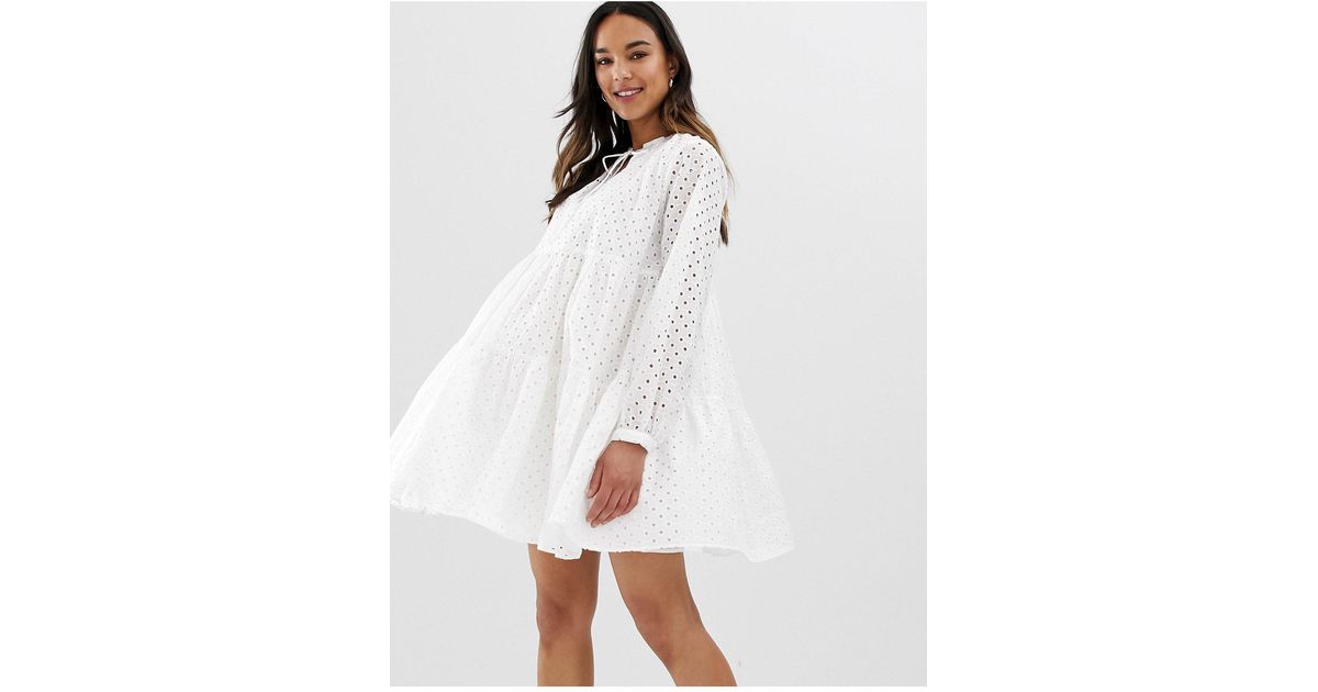 asos design petite tiered trapeze mini dress in broderie