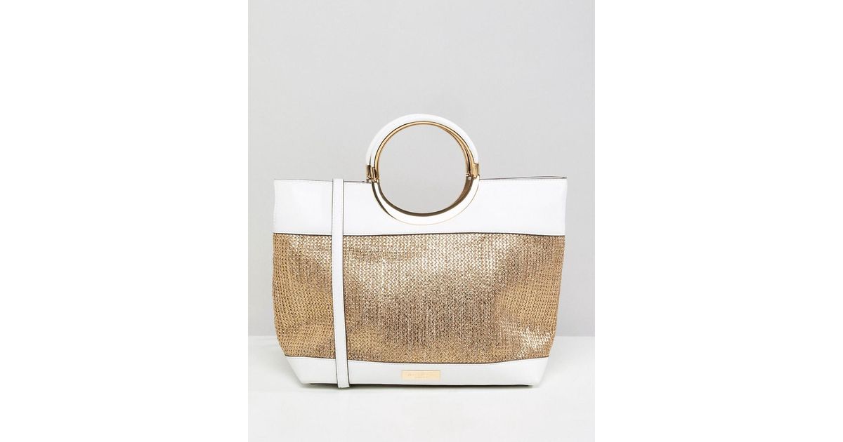 gold carvela bag