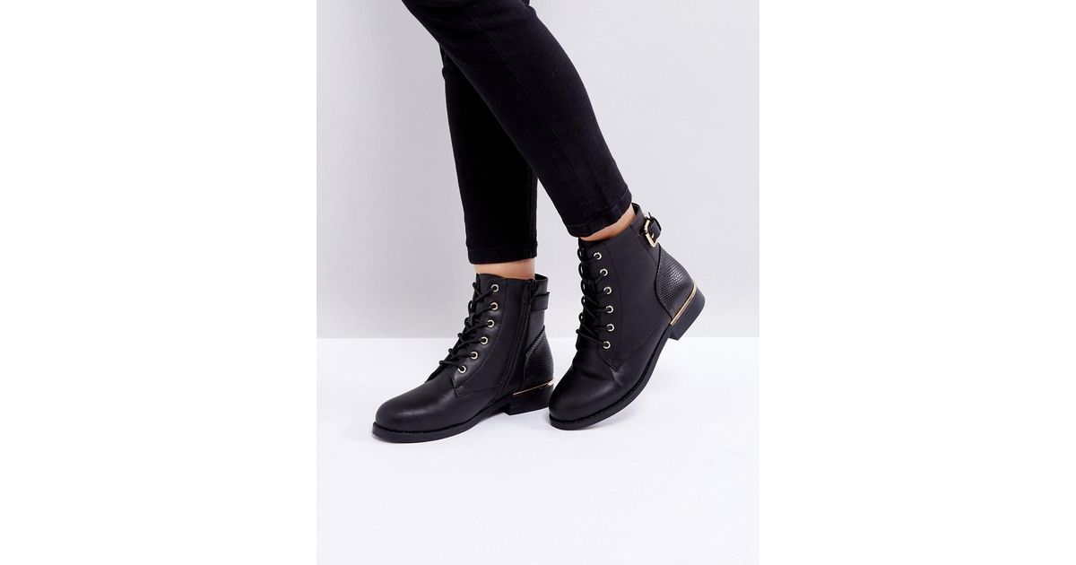 flat lace up black boots