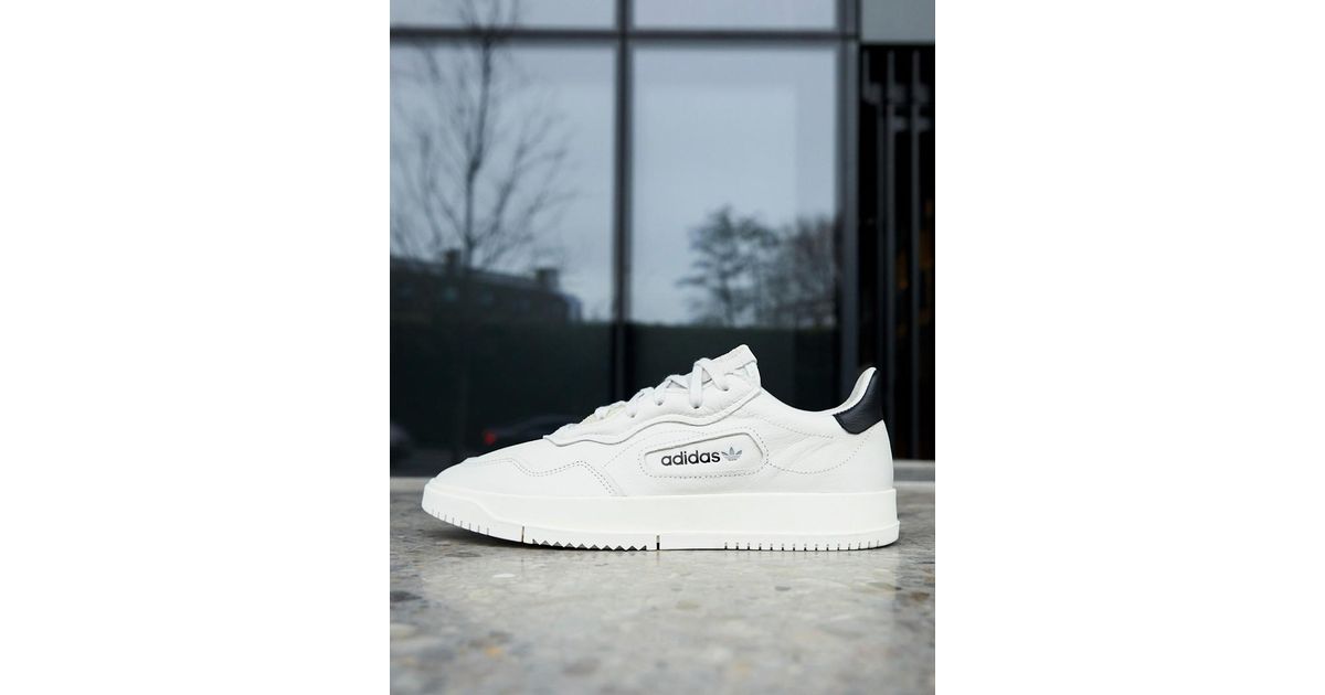 adidas originals sc premiere sneakers in white