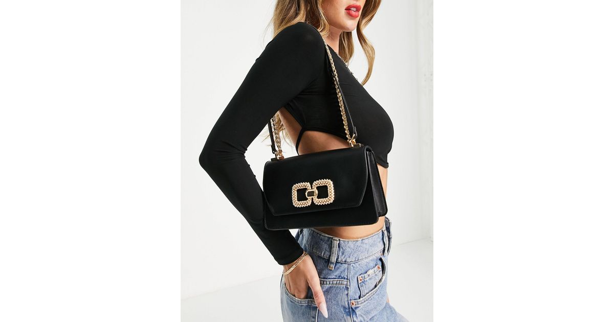 ALDO Sevorewen Crossbody Tas Met Gouden Detail in het Zwart Lyst NL