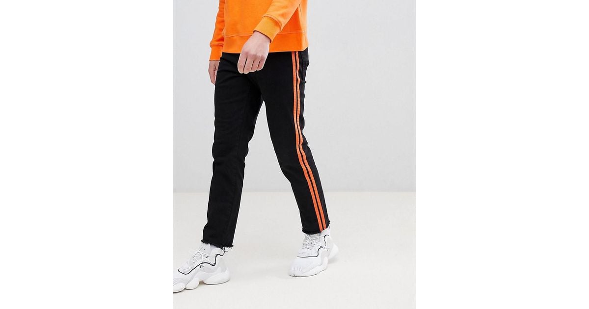 black jeans orange stripe