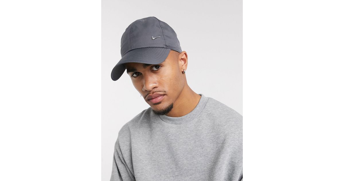 metal swoosh cap