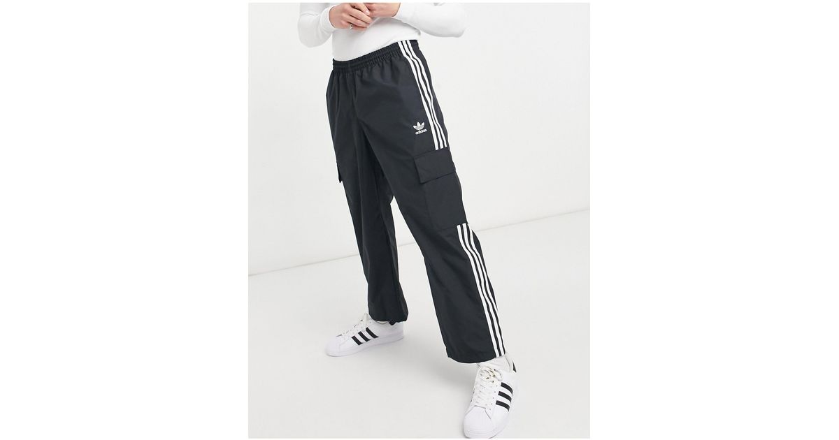 adidas Originals Adicolor Three Stripe Cargo Trousers With Pocket Detail in  Black for Men | Lyst