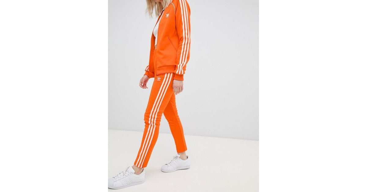 adidas Originals Three Stripe Cigarette Pants In Orange | Lyst