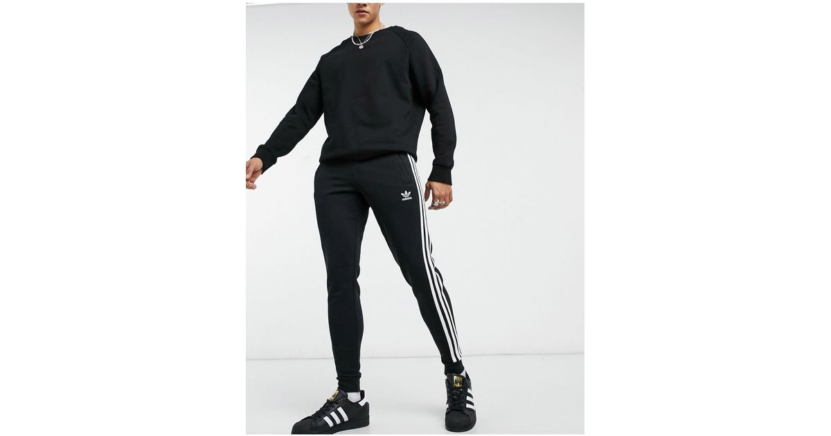 adidas Originals Adicolor Three Stripe Skinny joggers in Black for Men |  Lyst