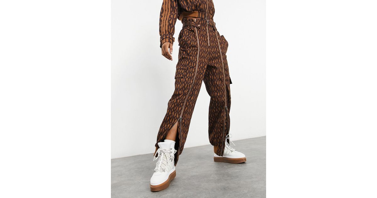 Ivy Park Adidas X Monogram Zip Detail Trousers in Brown | Lyst