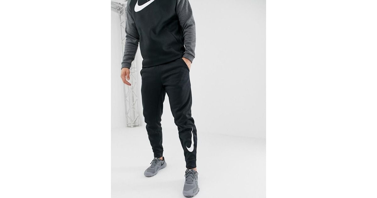 Nike training therma tapered top swoosh joggers in black