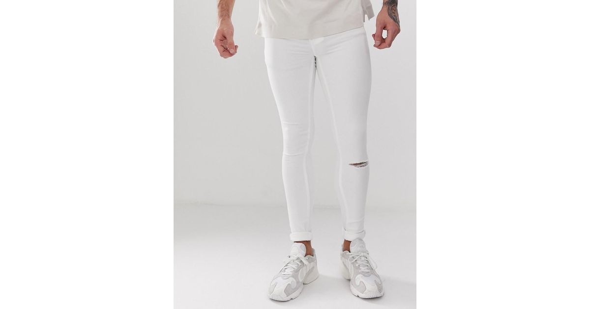 white knee cut jeans