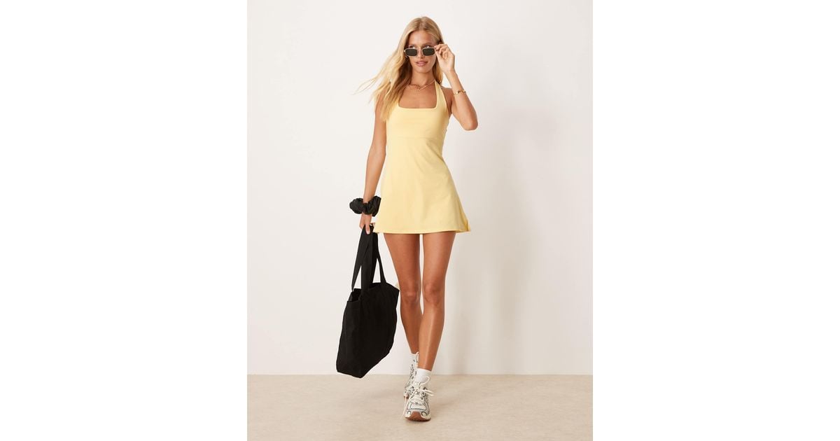 4505 Active Halter Neck Tennis Dress With Under Shorts in Yellow | Lyst 4505 Active Halter Neck Tennis Dress With Under Shorts in Yellow | Lyst