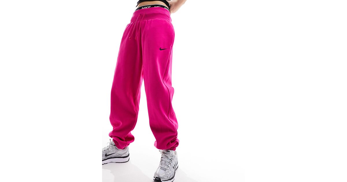 Nike Mini Swoosh Oversized Fleece joggers in Pink Lyst