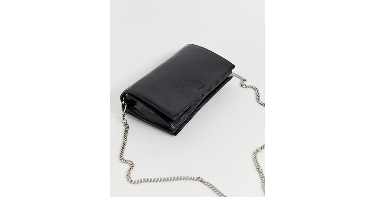 AllSaints Leder Leder-Umhngetasche im Geldbeutel-Stil mit Kettenriemen in  Schwarz | Lyst DE