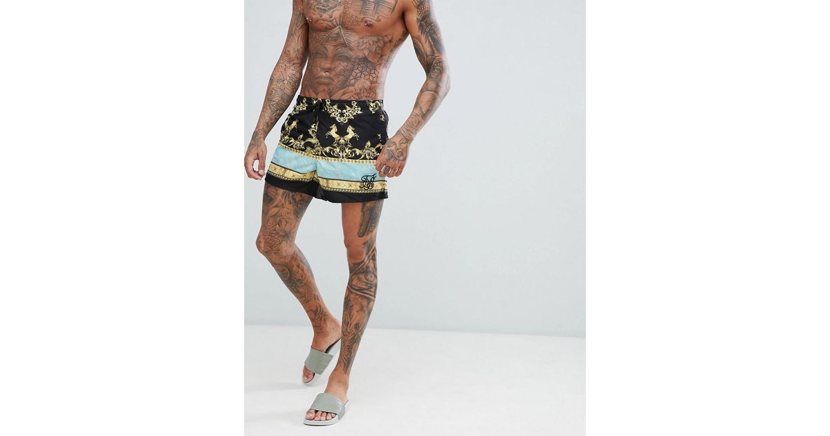 black and gold swim shorts