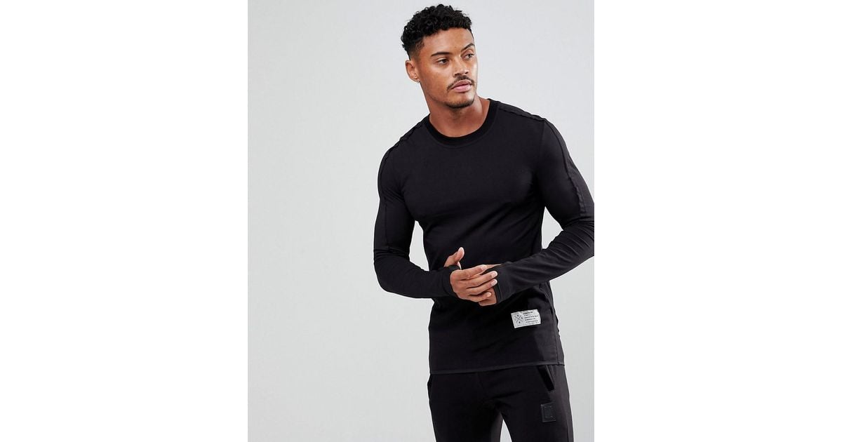 Religion Long Sleeve Muscle T-shirt With Thumb Hole in Black for