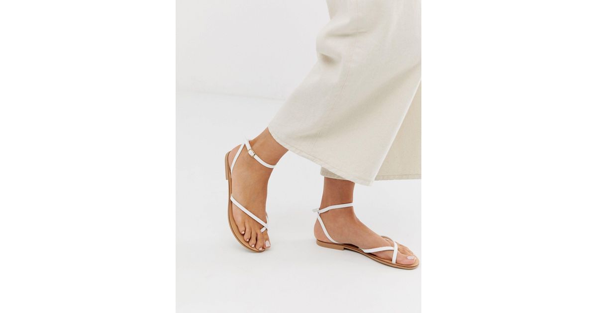 white toe loop sandals