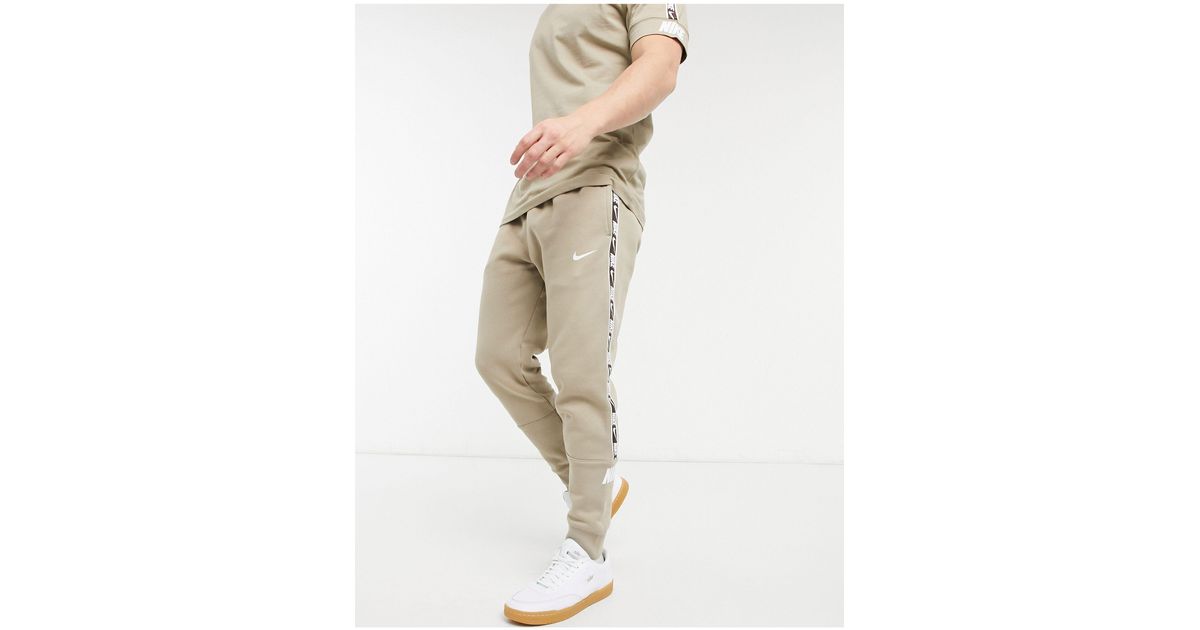 Nike Repeat Pack Taping Cuffed Trackies in Green (Natural) for Men | Lyst
