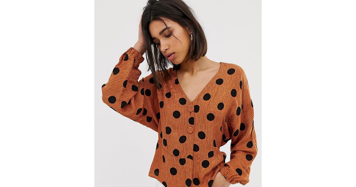 orange polka dot blouse