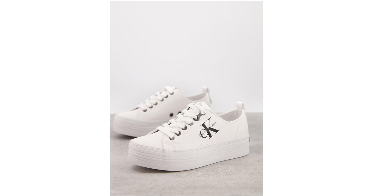 calvin klein zolah white canvas flatform trainers