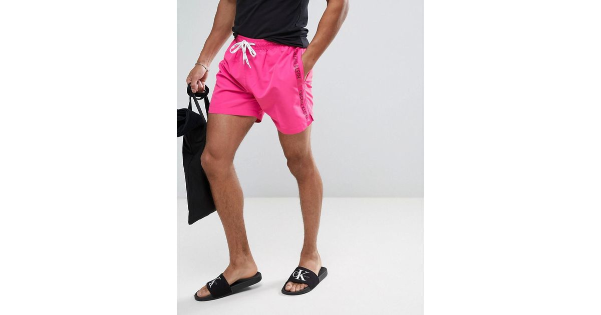 Calvin klein taped drawstring swim shorts hotsell