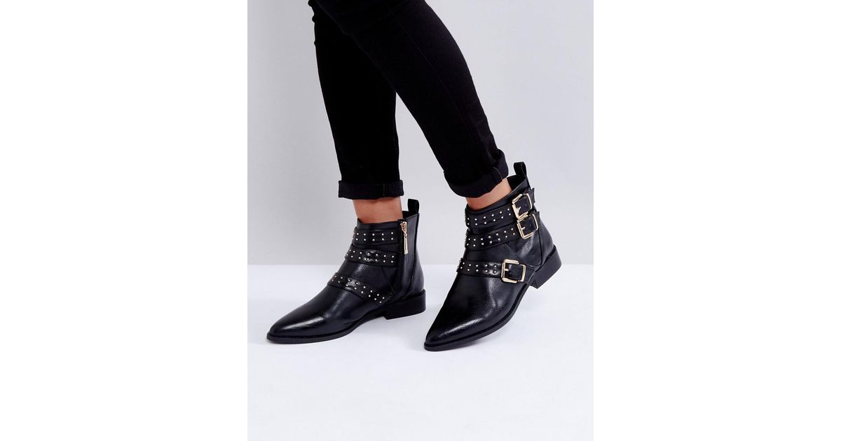 black flat buckle boots