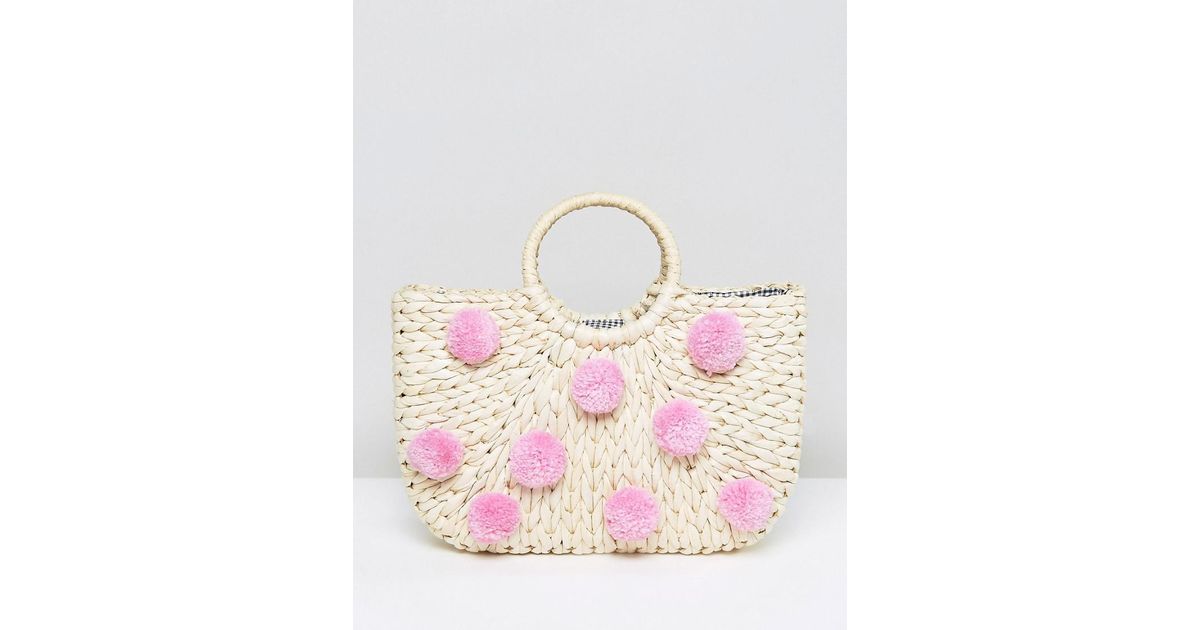 Skinnydip London Synthetic Straw Bag With All Over Pink Pom Poms in Beige (Natural) - Lyst