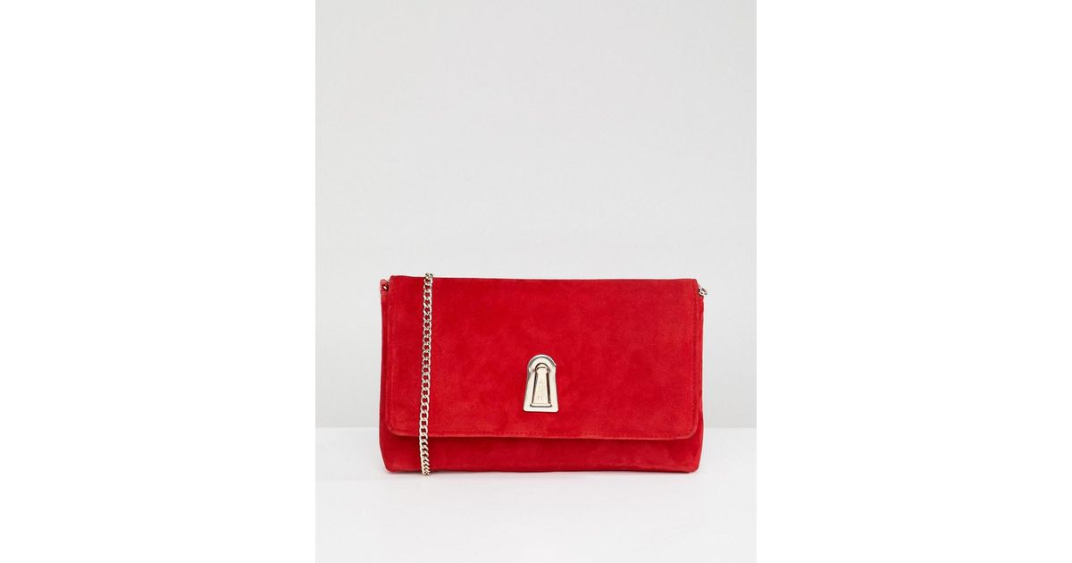 red suede clutch bag