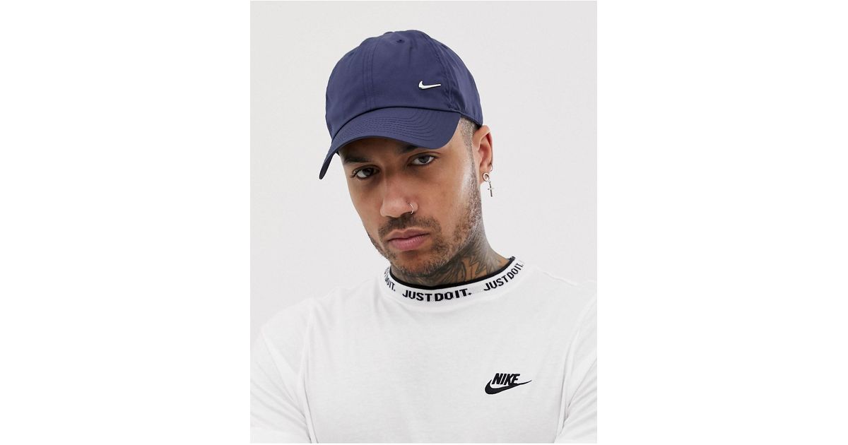 Nike swoosh top metal cap