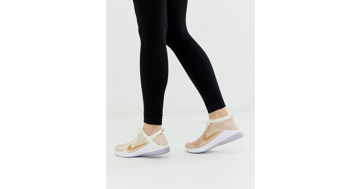 nike training air zoom fearless sneakers in rose gold