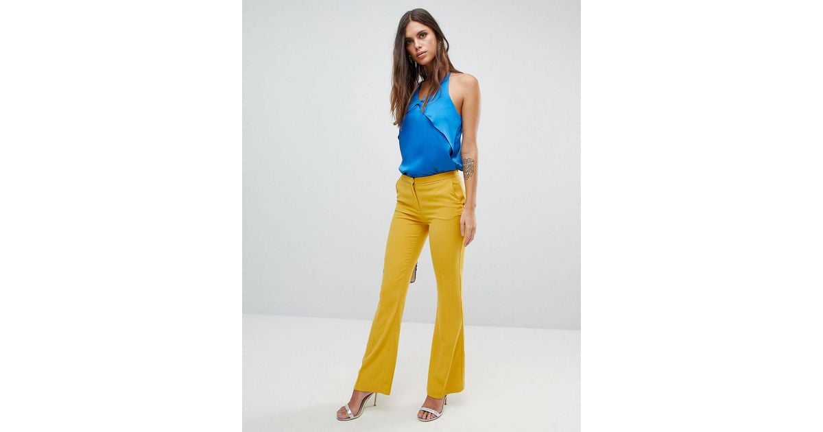 yellow flare trousers
