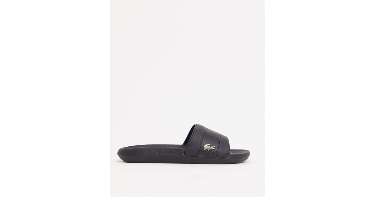 lacoste gold croc sliders in black