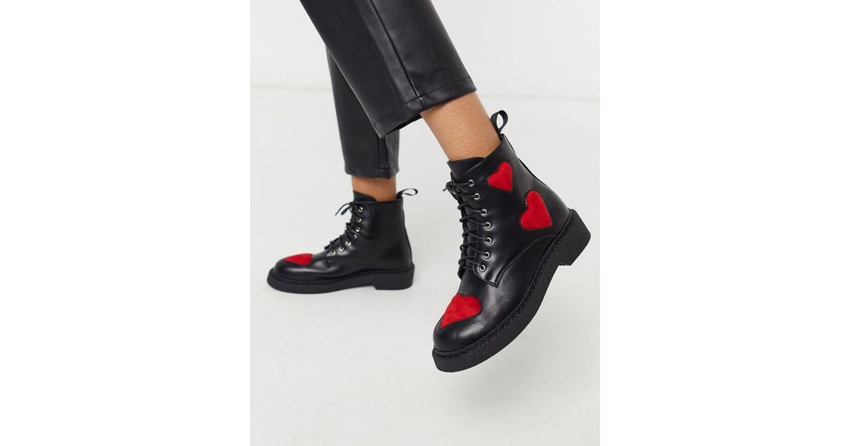 black flat lace up boots