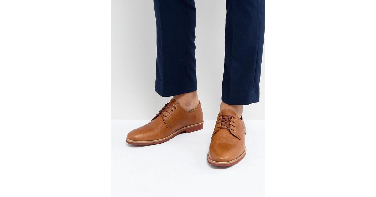red tape tan derby shoes