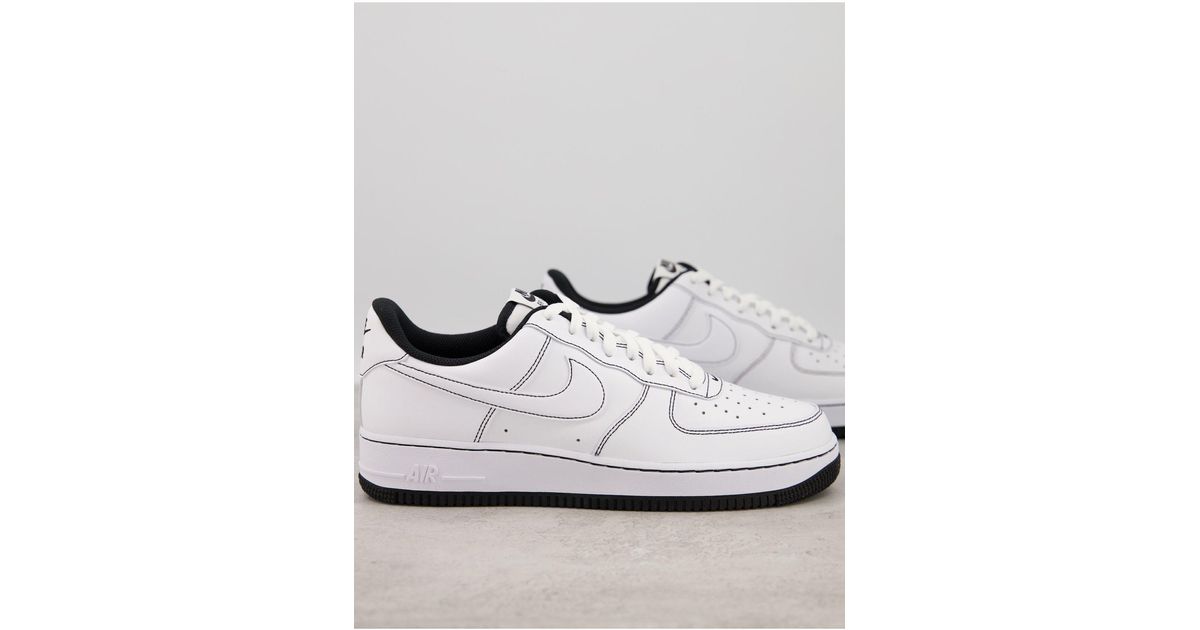 white air force ones with black outline