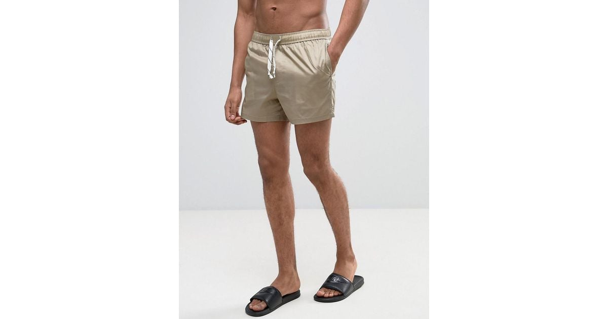 beige swim shorts