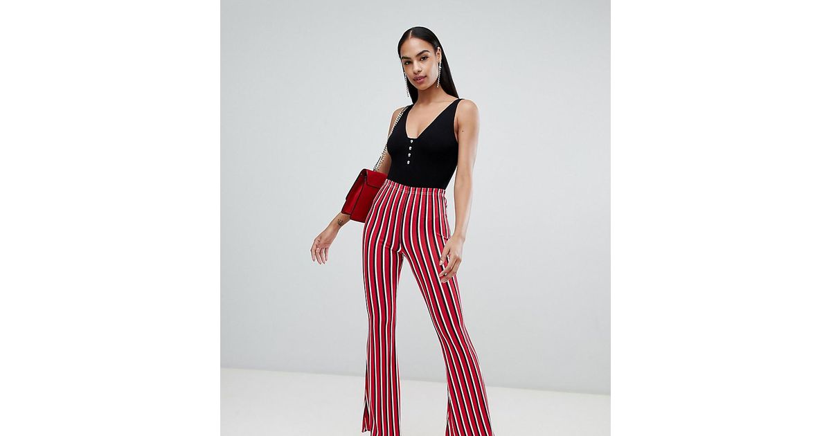 PrettyLittleThing Stripe Flare Trousers in Red