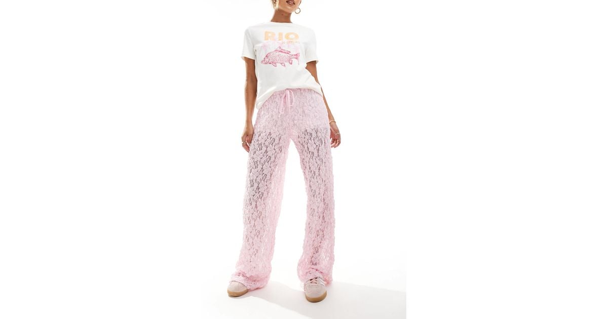 Pantalon taille basse en dentelle transparente bebe ASOS en coloris Rose Lyst