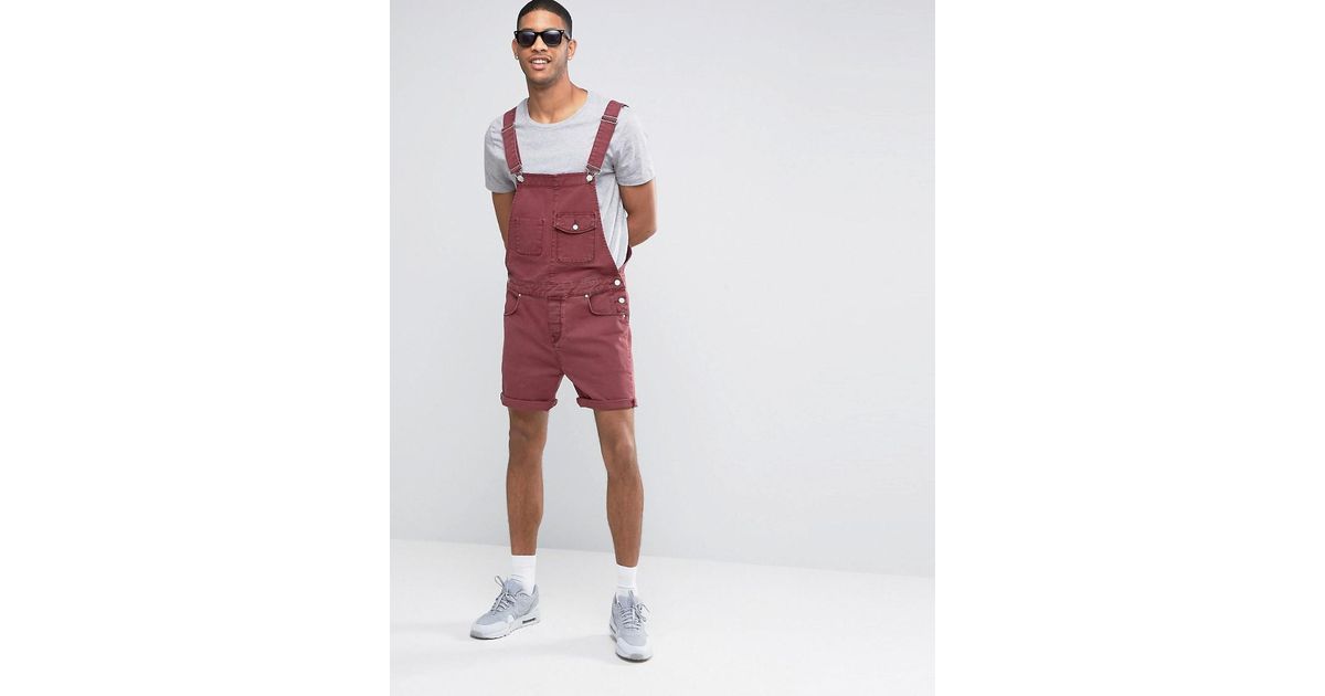 red short dungarees