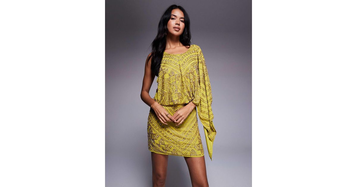 asos design mini dress with heavily embellished cape ASOS DESIGN embroidered dobby cape overlay mini dress in cream
