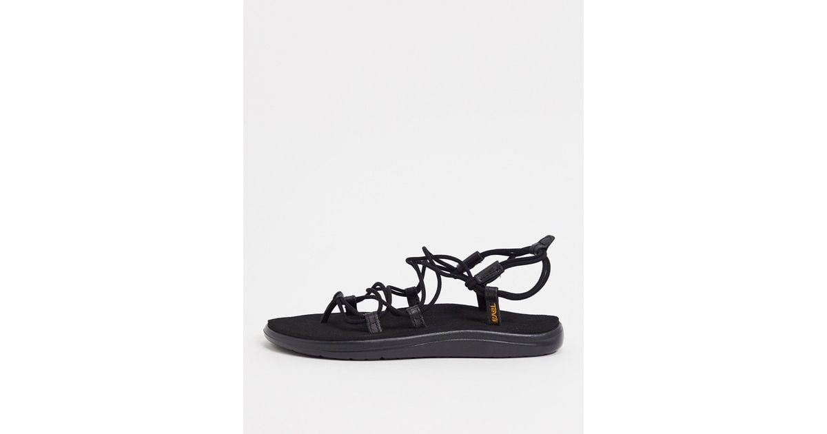 teva voya infinity lace up sandals in black