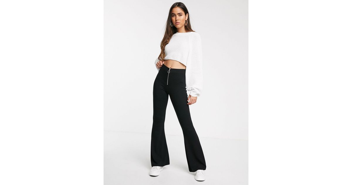 Stradivarius Petite crop flare jeans in black