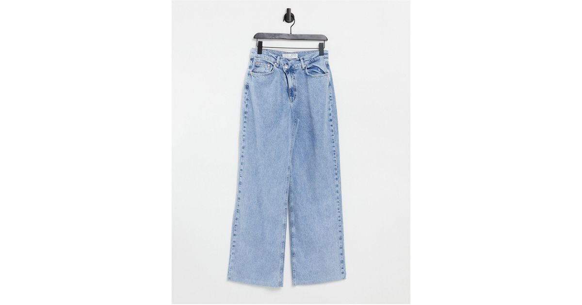 stradivarius stepped waist dad jean in washed blue