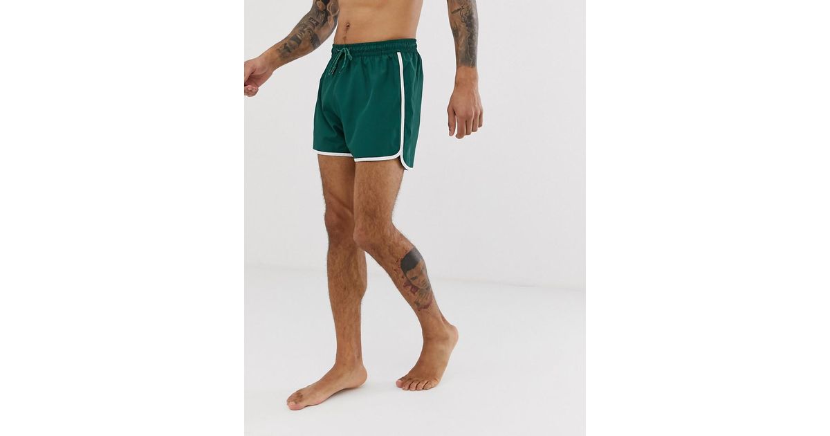tan swim shorts